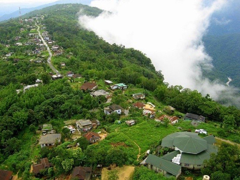 Misty waterfalls and green landscapes during Meghalaya monsoon tour