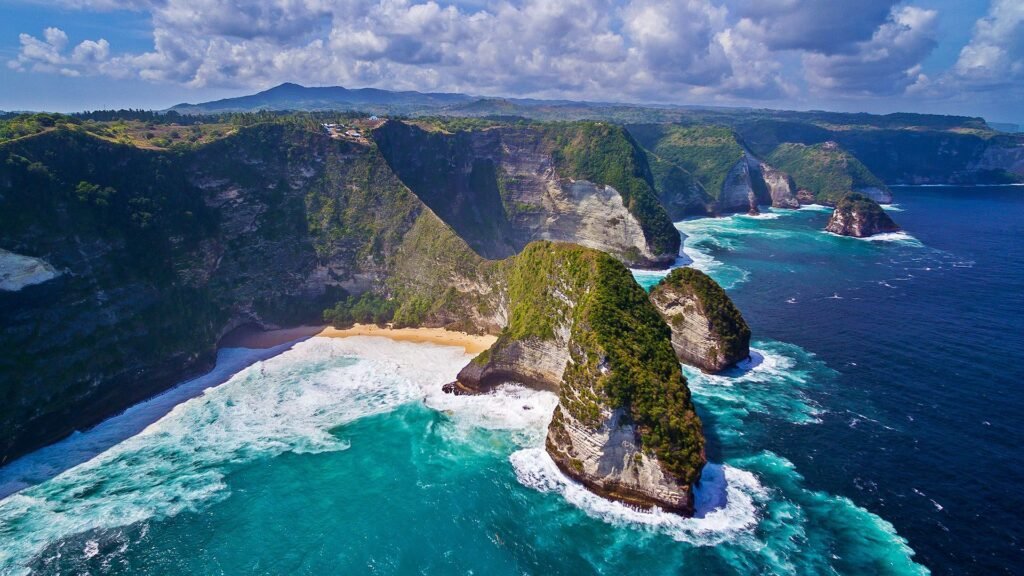 Island special Tour with bali tour package from bhubaneswar odisha with Gilli - Nusa Peninda Island-Aerial view of Kelingking Beach, Nusa Penida, highlight of Bali island hopping tour.