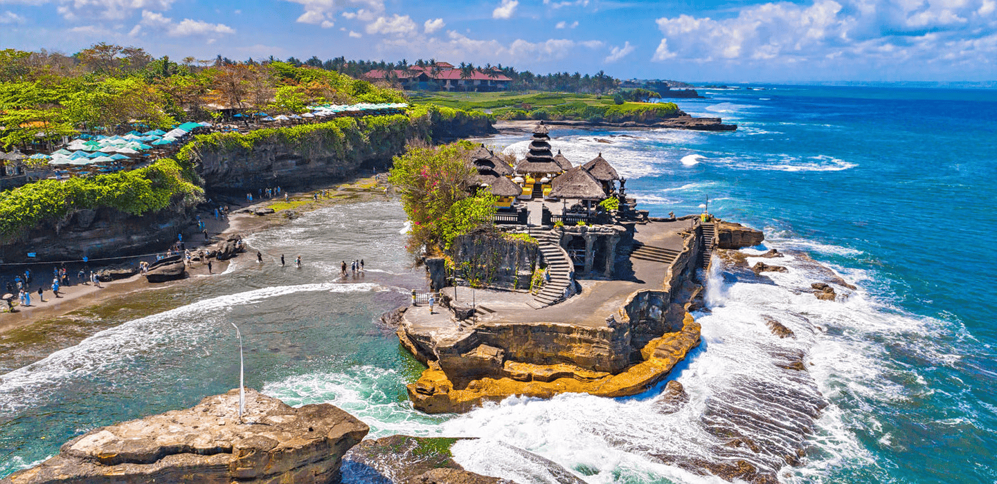 Iconic Tanah Lot Temple on Bali's coast, a highlight of Bali trips from Bhubaneswar